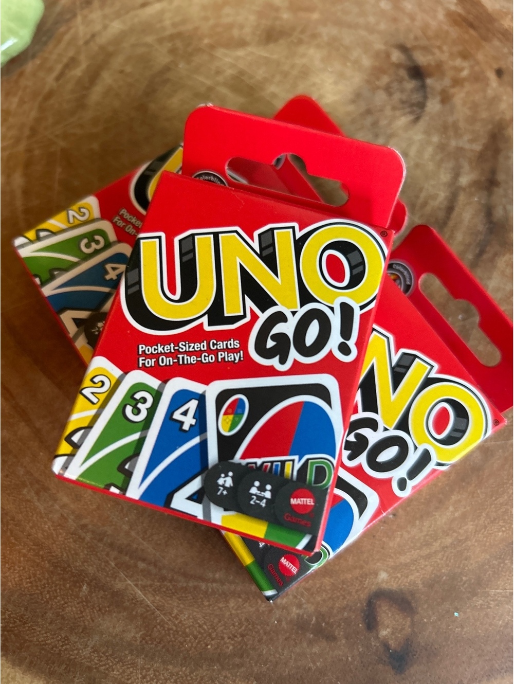 3 pocket sized uno card sets